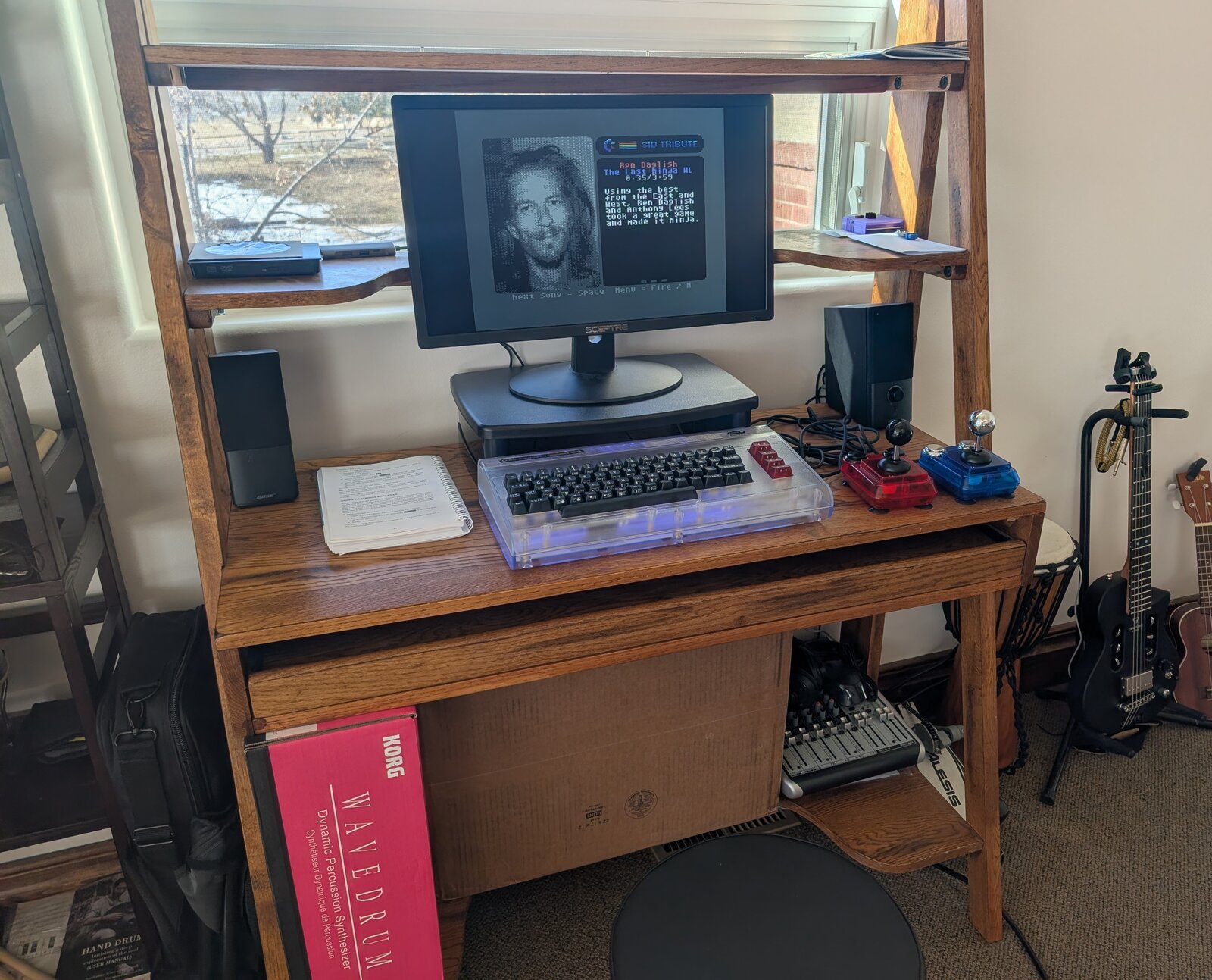 Commodore 64 Ultimate setup with speakers, joysticks, and modern monitor